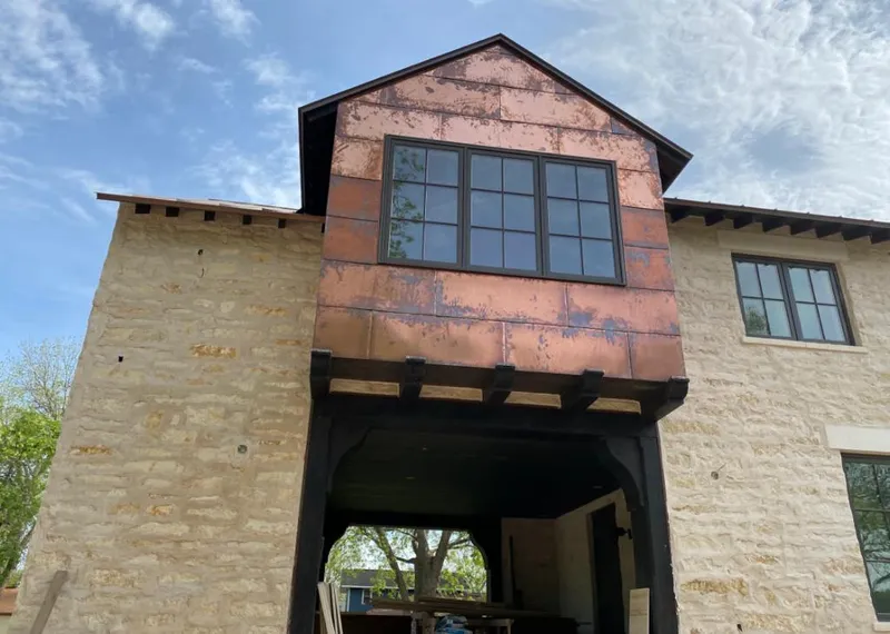 Copper metal panel facade on a stone building for Skylight Installation in Azusa